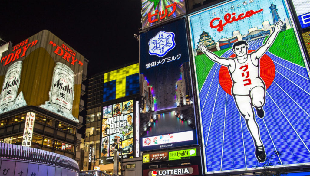 OSAKA, JAPAN - OCTOBER 28, 2013: The famed advertisements of Dotonbori. With a history reaching back to 1612, the district is now one of Osaka's primary tourist destinations.